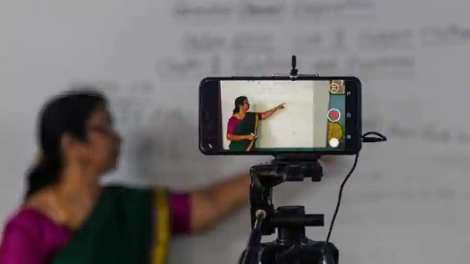 A school teacher gives a live streaming online class at a government school after the government eased a nationwide lockdown